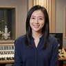 Mei, a 43-year-old woman in a recording studio